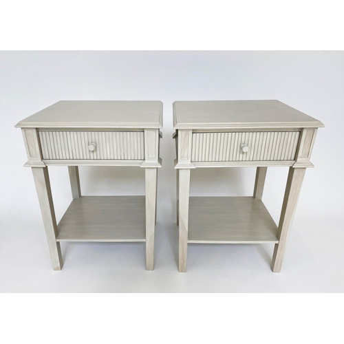 144 - OKA LAMP TABLES, a pair, distressed grey painted with fluted front drawer and undertier. (2)