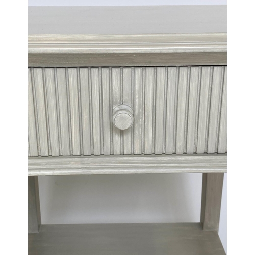 144 - OKA LAMP TABLES, a pair, distressed grey painted with fluted front drawer and undertier. (2)