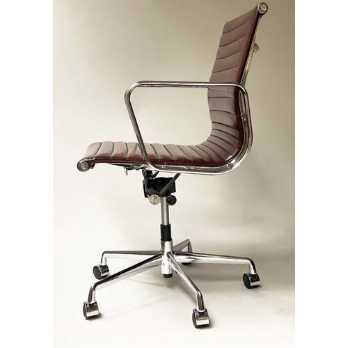 259 - REVOLVING DESK CHAIR, Charles and Ray Eames inspired with ribbed tan brown leather seat revolving an... 