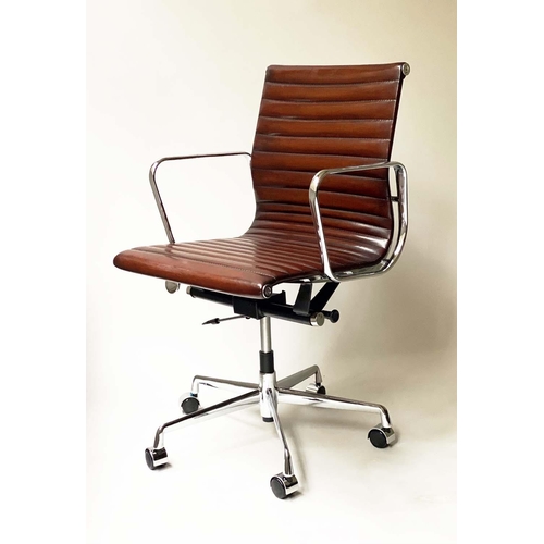 259 - REVOLVING DESK CHAIR, Charles and Ray Eames inspired with ribbed tan brown leather seat revolving an... 