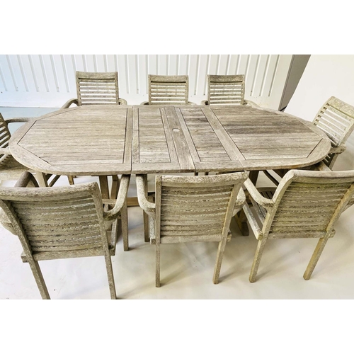 263 - EXTENDING GARDEN TABLE AND CHAIRS, a set, silvery weathered teak with eight armchairs and extending ... 