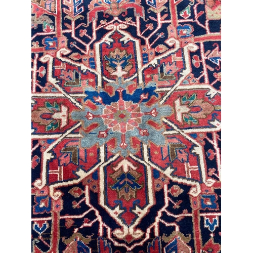 90 - ANTIQUE PERSIAN HERIZ CARPET, 339cm x 280cm.