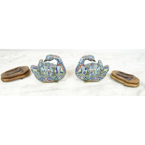 1 - CLOISONNE DUCK BOXES, a pair, on shaped wooden stands, 14cm x 14cm. (2)
