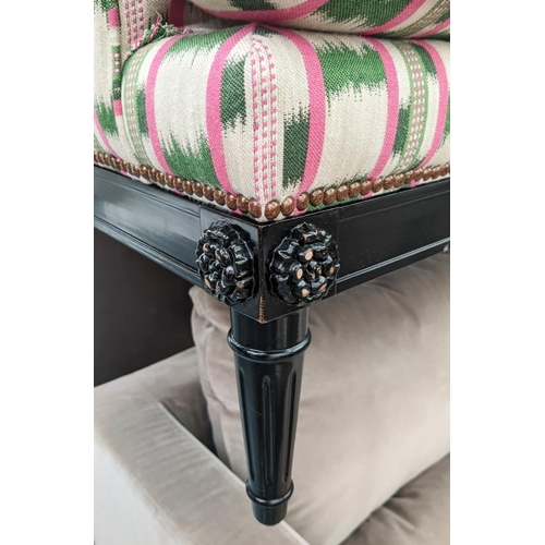 551 - SOFA, 186cm x 93cm D, in a pink and green ikat fabric with studded detail and ebonised base.