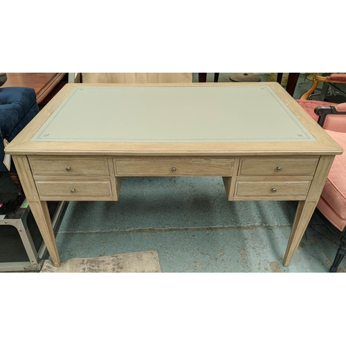 559 - DESK, 135cm W x 91cm D x 76cm H, limed oak with an inlaid grey leather writing surface.