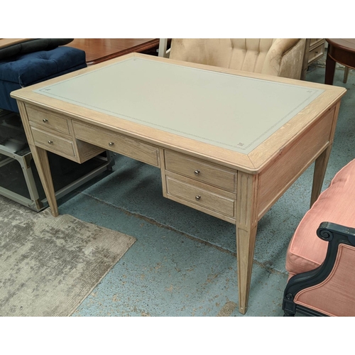 559 - DESK, 135cm W x 91cm D x 76cm H, limed oak with an inlaid grey leather writing surface.