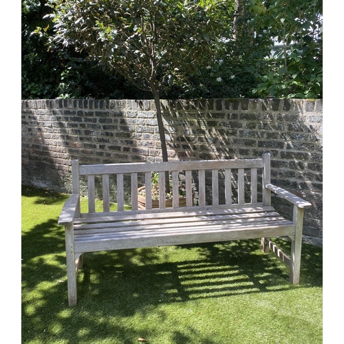 588 - GLOSTER GARDEN BENCH, silvery weathered teak of slatted form with flat top arms, 159cm W.