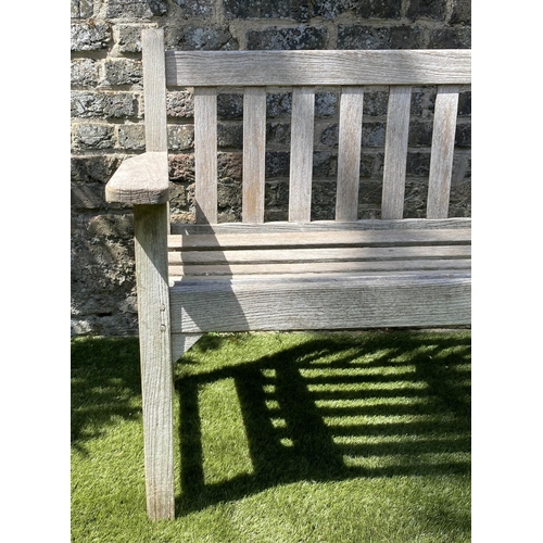 588 - GLOSTER GARDEN BENCH, silvery weathered teak of slatted form with flat top arms, 159cm W.