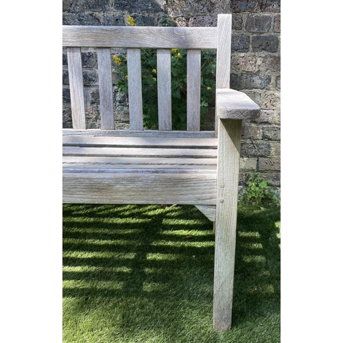 588 - GLOSTER GARDEN BENCH, silvery weathered teak of slatted form with flat top arms, 159cm W.