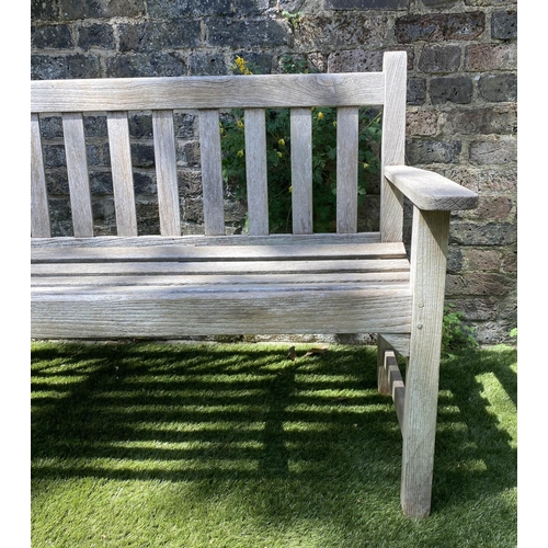 588 - GLOSTER GARDEN BENCH, silvery weathered teak of slatted form with flat top arms, 159cm W.