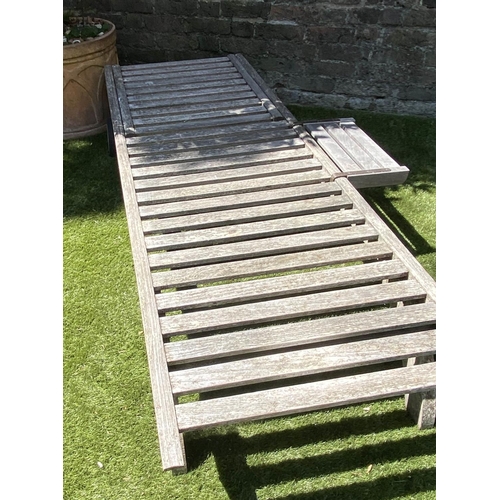 591 - BARLOW TYRIE GARDEN SUN LOUNGER, weathered slatted teak fully, adjustable with wheels, drinks tray a... 