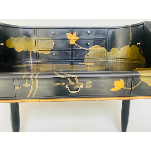 258 - CARLTON HOUSE STYLE DESK, lacquered with all over foliate and gilt decoration containing nine drawer... 