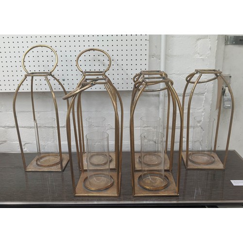 527 - CANDLE LANTERNS, a set of six, 52cm H, gilt metal, glass inserts. (6)