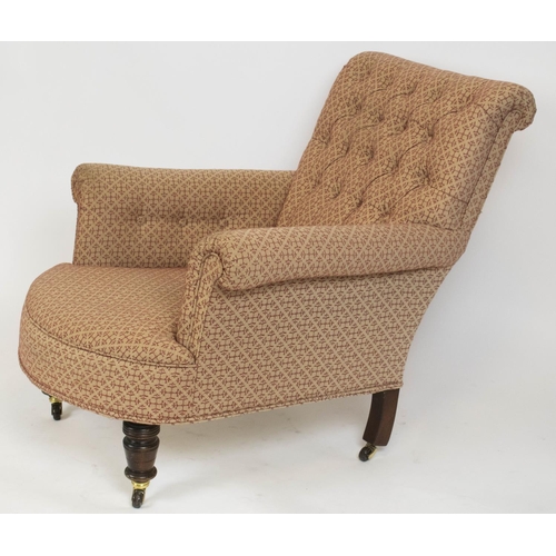 329 - ARMCHAIR, 82cm H x 89cm W, late Victorian in Howard style and patterned material on later castors.