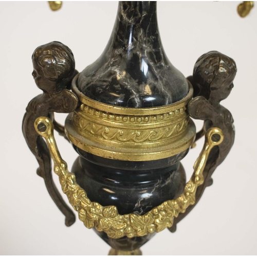 44 - CANDELABRA, a pair, Italian brevettato gilded metal seven branch with black marble and putto detail.... 