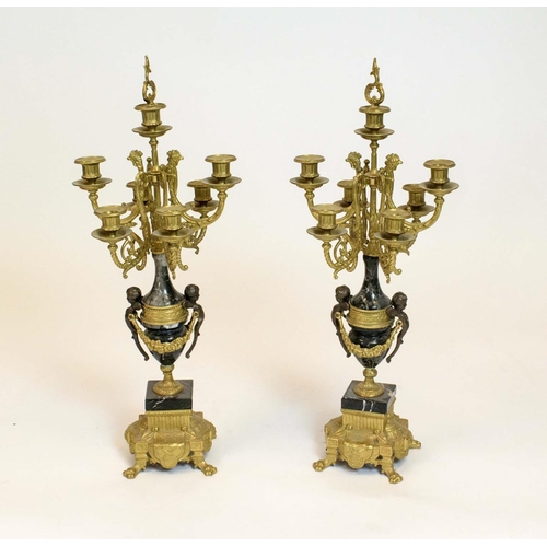 44 - CANDELABRA, a pair, Italian brevettato gilded metal seven branch with black marble and putto detail.... 