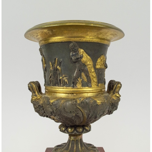 7 - PEDESTAL MANTLE URNS, a pair, possibly French, the urns of two handled form with gilt bronze with Cl... 