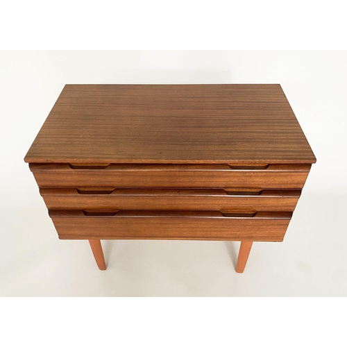 373 - CHEST, 1960's Afromosia teak, with three long drawers, integral handles and shaped tapering supports... 