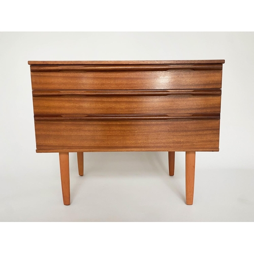 373 - CHEST, 1960's Afromosia teak, with three long drawers, integral handles and shaped tapering supports... 