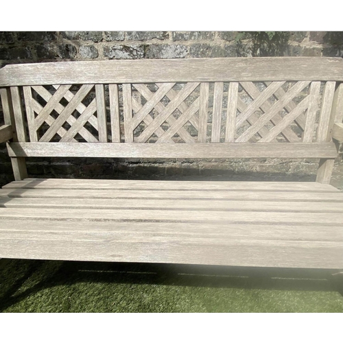 380 - LATTICE GARDEN BENCH, well weathered teak with triple lattice panelled back and slatted seat, 146cm ... 