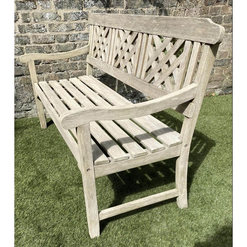 380 - LATTICE GARDEN BENCH, well weathered teak with triple lattice panelled back and slatted seat, 146cm ... 