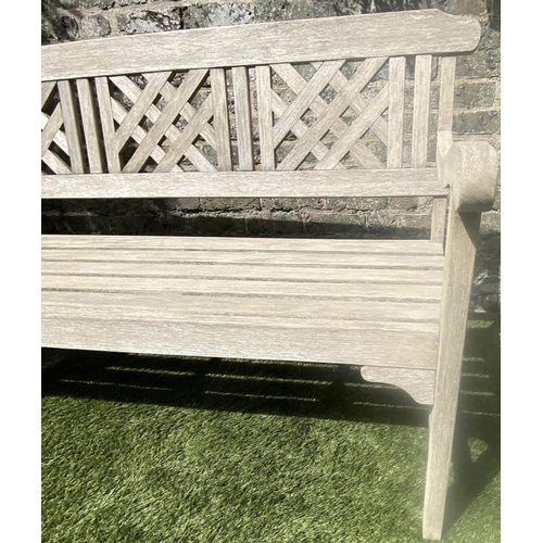 380 - LATTICE GARDEN BENCH, well weathered teak with triple lattice panelled back and slatted seat, 146cm ... 