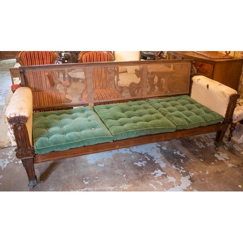 344 - SOFA, 91cm H, 218cm W x 77cm D, Regency rosewood, circa 1820, with caned back, seat, green plush sea... 