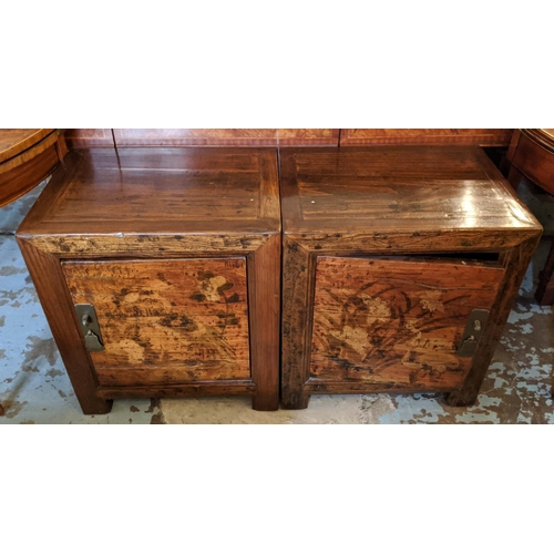 CHINESE BEDSIDE CABINETS, a pair, each 55cm L x 40cm D x 64cm H, with decorative detail to door. (2)