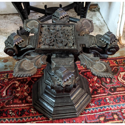 266 - LOW TABLE, Indian ebonised with revolving support and hexagonal glass top, 61cm x 61cm x 48cm H.