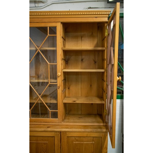 241 - BOOKCASE, late 20th century, Georgian style, pine of two glazed doors enclosing divided adjustable s... 