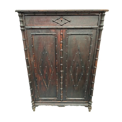 162 - FAUX BAMBOO CUPBOARD, 19th century French, single frieze drawer above two panel doors enclosing shel... 