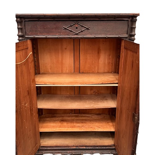 162 - FAUX BAMBOO CUPBOARD, 19th century French, single frieze drawer above two panel doors enclosing shel... 