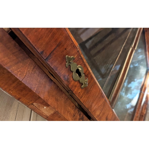 250 - HANGING CORNER CUPBOARD, George I walnut, circa 1720, with a glazed door enclosing one real and two ... 