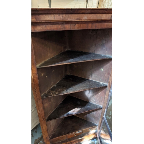 250 - HANGING CORNER CUPBOARD, George I walnut, circa 1720, with a glazed door enclosing one real and two ... 