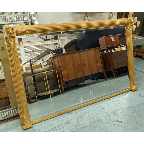 180 - OVERMANTEL, Regency style, gilt with lion mask decoration and a rectangular bevelled plate, 183cm W ... 