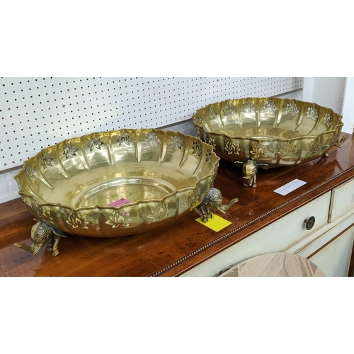 451 - INDIAN STYLE CHARGER BOWLS, a pair, with elephant detail, gilt metal 46cm diam x 15cm H. (2)