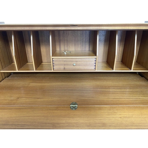 337 - NATHAN TEAK BUREAU, 1970s teak, with fall front fitted interior, writing surface and four long drawe... 