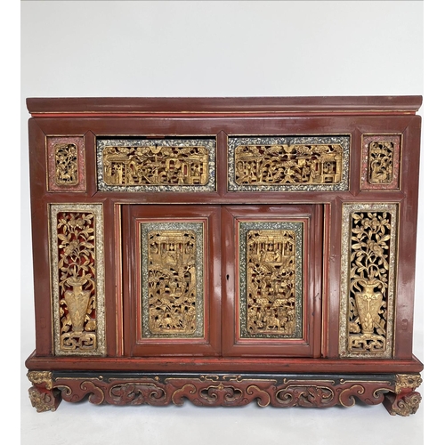 232 - CHINESE CABINET, 19th century Chinese scarlet lacquered and carved giltwood inset panels with two dr... 