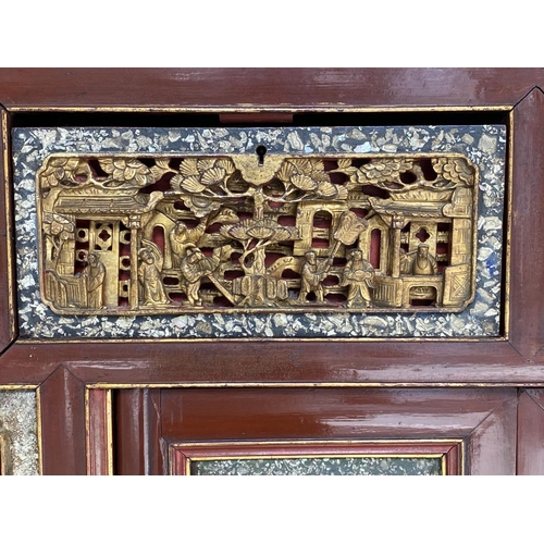 232 - CHINESE CABINET, 19th century Chinese scarlet lacquered and carved giltwood inset panels with two dr... 