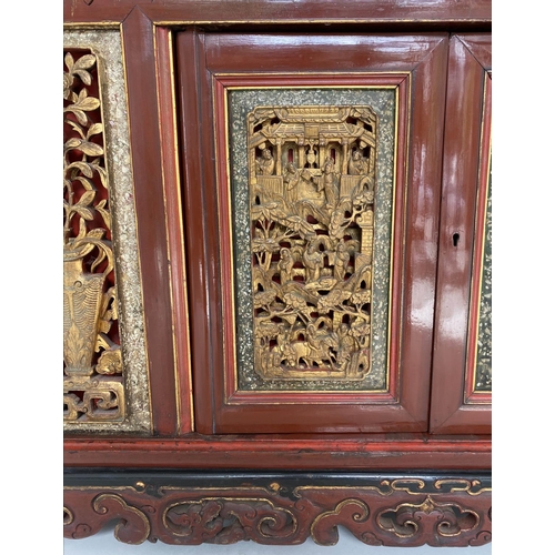 232 - CHINESE CABINET, 19th century Chinese scarlet lacquered and carved giltwood inset panels with two dr... 