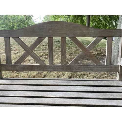 235 - GARDEN BENCH, silvery weathered teak with double 'X' back, 119cm W.