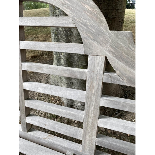 197 - GARDEN BENCH, weathered slatted teak, after a design by Sir Edwin Lutyens, 166cm W.