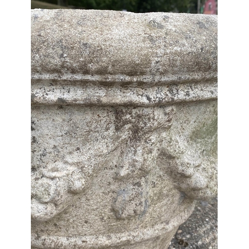 198 - GARDEN PLANTERS, a set of three, well weathered reconstituted stone, each with swag detail, 50cm x 3... 