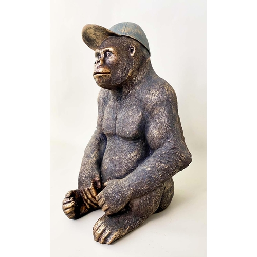 478 - GORILLA WITH BASEBALL CAP, resin with painted finish, 58cm x 40cm x 34cm.