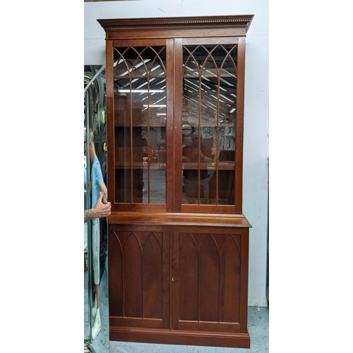 498 - BOOKCASE, cherrywood, gothic astrical detail, 244cm H x 117cm W x 53cm D.