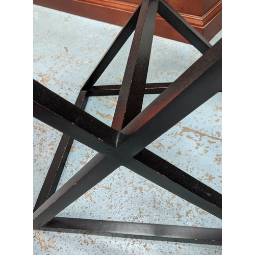 472 - SIDE TABLE, X frame design, ebonised, glass top, 710cm x 61cm H.