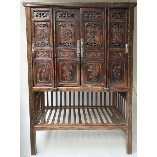 294 - CHINESE MARRIAGE CABINET, 19th century Chinese lacquered with four hinged carved and pieced doors en... 