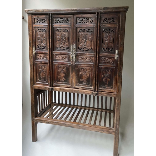 294 - CHINESE MARRIAGE CABINET, 19th century Chinese lacquered with four hinged carved and pieced doors en... 