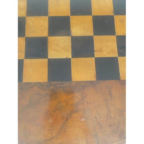 115 - GAMES TABLE, Victorian figured walnut circular with chess board inset and carved tripod, 56cm x 72cm... 