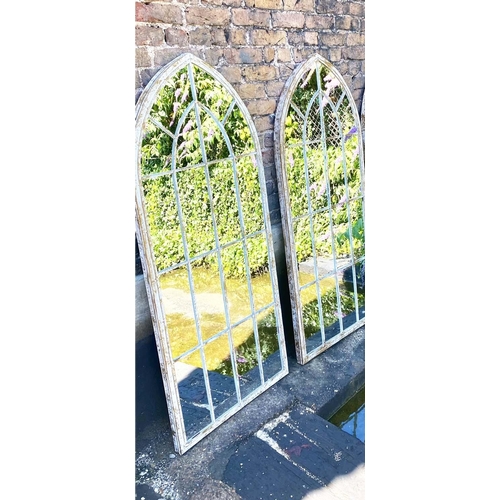 400 - ARCHITECTURAL GARDEN WALL MIRRORS, a pair, aged metal frames, 160cm x 67cm. (2)